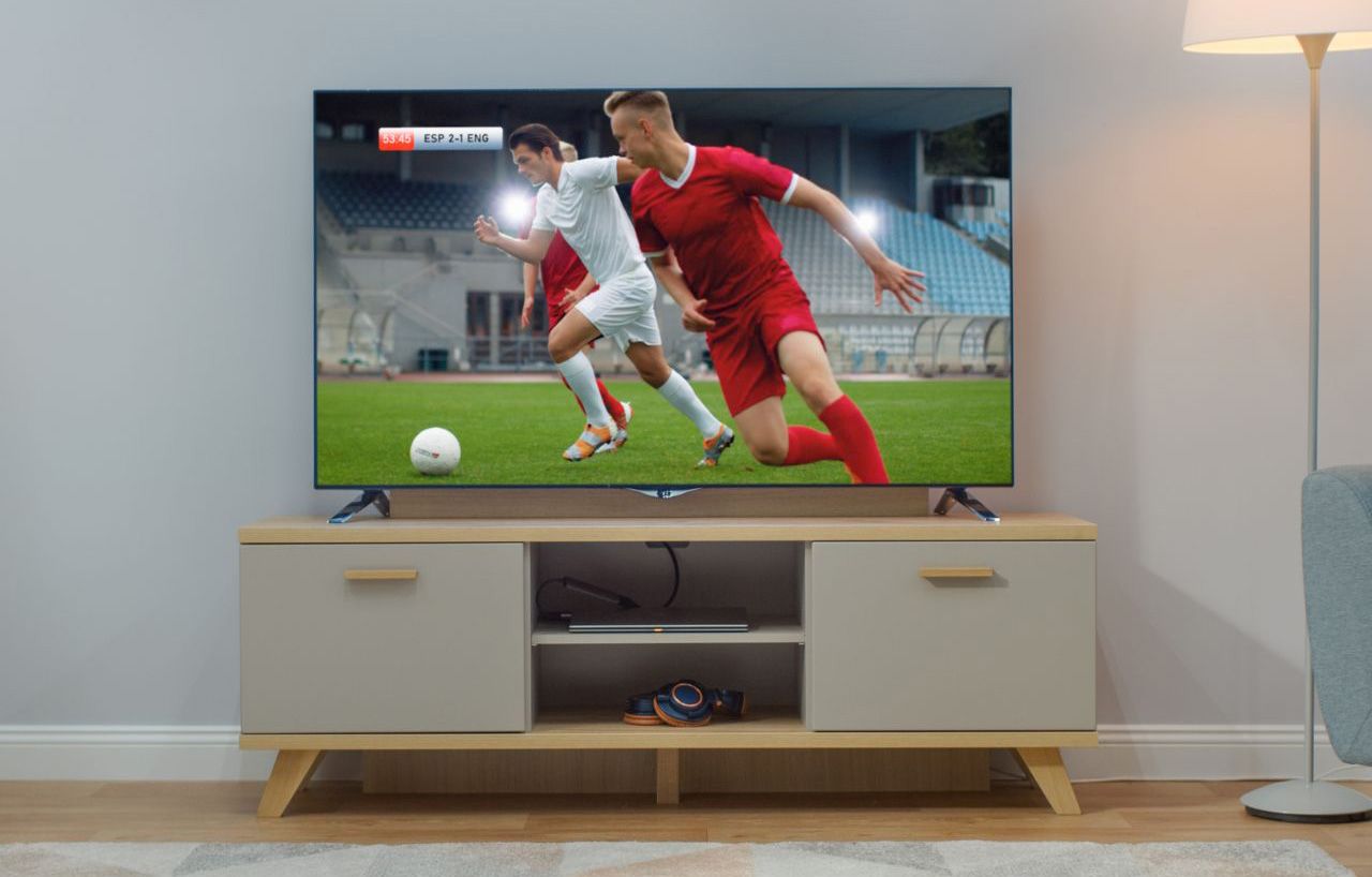TV Setup with Zoomy Computers TV in living room with soccer on